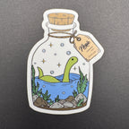 Sticker of a green dinosaur in a bottle with water and plants on a gray background