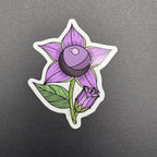 Sticker of a purple flower with green leaves on a gray background