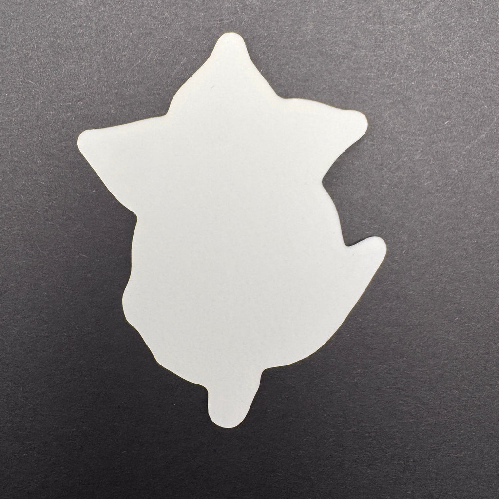 White star-shaped object on a black background