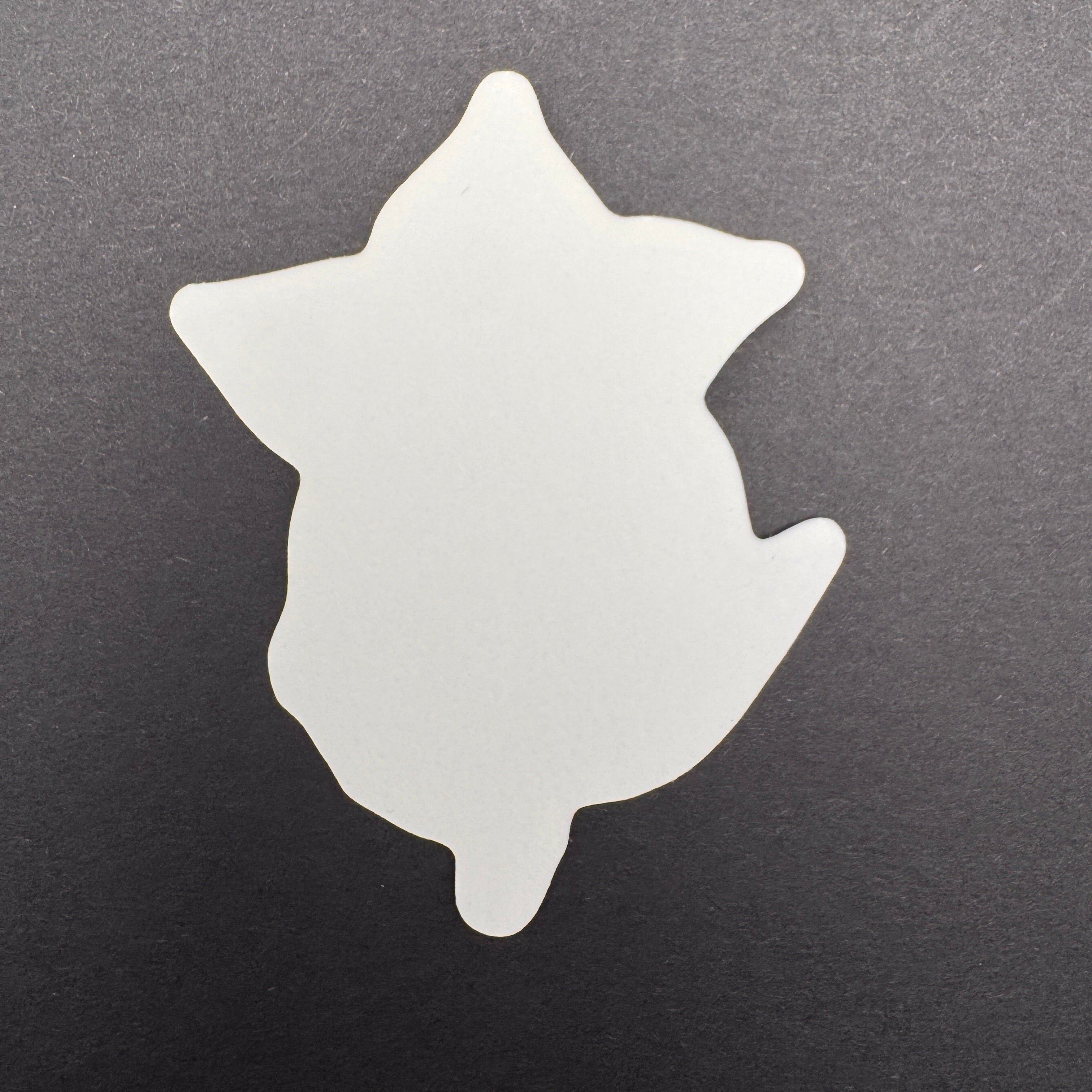 White star-shaped object on a black background